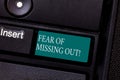 Text sign showing Fear Of Missing Out. Conceptual photo Afraid of losing something or someone stressed Keyboard key