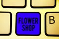 Text sign showing Flower Shop. Conceptual photo where cut flowers are sold with decorations for gifts Keyboard blue key Intention Royalty Free Stock Photo