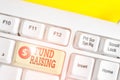 Text sign showing Fund Raising. Conceptual photo the act of seeking to generate financial support for a charity White pc