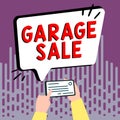 Text sign showing Garage Sale. Business showcase sale of miscellaneous household goods often held in the garage