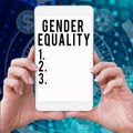 Text sign showing Gender Equality. Conceptual photo access to same privilege given to both men and women Mobile Phone