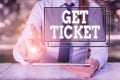 Text sign showing Get Ticket. Conceptual photo to have printed paper that permits entry to an event or show Female Royalty Free Stock Photo