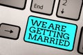 Text sign showing We Are Getting Married. Conceptual photo Engagement Wedding preparation Loving couple Silver grey computer keybo