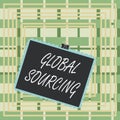 Text sign showing Global Sourcing. Conceptual photo practice of sourcing from the global market for goods Stamp stuck binder clip