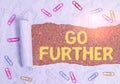 Text sign showing Go Further. Conceptual photo To make a bolder statement about something being discussed Paper clip and