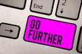 Text sign showing Go Further. Conceptual photo To move to a greater distance or overcome your limitations Keyboard purple key Inte