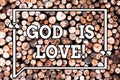 Text sign showing God Is Love. Conceptual photo Believing in Jesus having faith religious thoughts Christianity Wooden