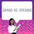 Hand writing sign Grand Re Opening. Conceptual photo held to mark the opening of a new business or public place