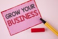 Text sign showing Grow Your Business. Conceptual photo improve your work enlarge company overcome competitors written on Pink Stic