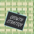 Text sign showing Growth Strategy. Conceptual photo Strategy aimed at winning larger market share in shortterm Stamp stuck binder