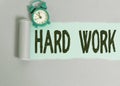 Text sign showing Hard Work. Conceptual photo always putting a lot of effort and care into work or endurance Alarm clock