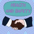 Text sign showing Health And Safety. Conceptual photo procedures intended to prevent accident in workplace Hand Shake Royalty Free Stock Photo