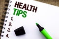 Text sign showing Health Tips. Conceptual photo Healthy Suggestions Suggest Information Guidance Tip Idea written on Notebook Book