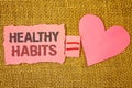 Text sign showing Healthy Habits. Conceptual photo Good nutrition diet take care of oneself Weight Control Text pink torn note equ Royalty Free Stock Photo