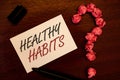 Text sign showing Healthy Habits. Conceptual photo Good nutrition diet take care of oneself Weight Control Text white paper note b Royalty Free Stock Photo