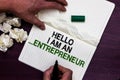 Text sign showing Hello I Am An ...Entrepreneur. Conceptual photo person who sets up a business or startups Man holding marker not