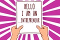 Text sign showing Hello I Am An ...Entrepreneur. Conceptual photo person who sets up a business or startups Man holding paper impo