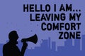 Text sign showing Hello I Am... Leaving My Comfort Zone. Conceptual photo Making big changes Evolution Growth Man holding megaphon