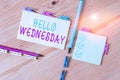 Text sign showing Hello Wednesday. Conceptual photo Hump day Middle of the working week of the calendar Colored clothespin papers