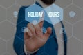 Text sign showing Holiday Hours. Conceptual photo employee receives twice their normal pay for all hours Male human wear Royalty Free Stock Photo