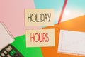 Text sign showing Holiday Hours. Conceptual photo employee receives twice their normal pay for all hours Office appliance colorful