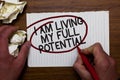 Text sign showing I Am Living My Full Potential. Conceptual photo Embracing opportunities using skills abilities Hand hold paper l