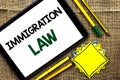 Text sign showing Immigration Law. Conceptual photo National Regulations for immigrants Deportation rules written on Tablet on the