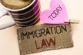 Text sign showing Immigration Law. Conceptual photo National Regulations for immigrants Deportation rules written on Tear Cardboar