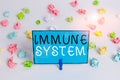 Text sign showing Immune System. Conceptual photo host defense system comprising many biological structures Colored crumpled Royalty Free Stock Photo