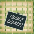 Text sign showing Islamic Banking. Conceptual photo Banking system based on the principles of Islamic law Stamp stuck binder clip