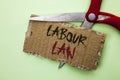 Text sign showing Labour Law. Conceptual photo Employment Rules Worker Rights Obligations Legislation Union written on Tear Cardbo