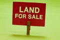 Text sign showing Land For Sale. Conceptual photo Real Estate Lot Selling Developers Realtors Investment Clothespin Royalty Free Stock Photo