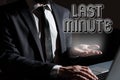 Text sign showing Last Minute. Conceptual photo done or occurring at the latest possible time before event Man Typing Royalty Free Stock Photo