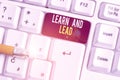 Text sign showing Learn And Lead. Conceptual photo Improve the skills and knowleadge to fit for the leadership White pc Royalty Free Stock Photo