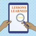 Text sign showing Lessons Learned. Conceptual photo the knowledge or understanding gained by experience Hands Holding