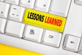 Text sign showing Lessons Learned. Conceptual photo the knowledge or understanding gained by experience White pc Royalty Free Stock Photo