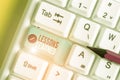 Text sign showing Lessons Learned. Conceptual photo the knowledge or understanding gained by experience White pc keyboard with Royalty Free Stock Photo