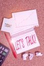 Text sign showing Let S Talk. Conceptual photo they are suggesting beginning conversation on specific topic Desk notebook paper Royalty Free Stock Photo