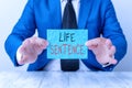 Text sign showing Life Sentence. Conceptual photo the punishment of being put in prison for a very long time Man holds empty paper