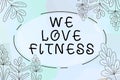 Text caption presenting We Love Fitness. Business concept Having affection for sport exercises good healthy diet Woman Royalty Free Stock Photo