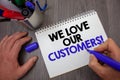 Text sign showing We Love Our Customers Call. Conceptual photo Client deserves good service satisfaction respect Man hold holding Royalty Free Stock Photo