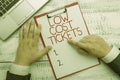 Text sign showing Low Cost Tickets. Conceptual photo small paper bought to provide access to service or show Hand hold