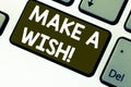 Text sign showing Make A Wish. Conceptual photo To have dreams desires about future events Be positive Keyboard key Royalty Free Stock Photo