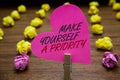 Text sign showing Make Yourself A Priority. Conceptual photo Think in your own good first personal development Paperclip hold pink