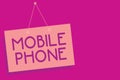 Text sign showing Mobile Phone. Conceptual photo A handheld device used to send receive calls and messages Pink board wall message