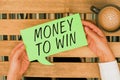 Text sign showing Money To Win. Business idea Calculating revenues are going to be obtained doing something