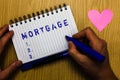 Text sign showing Mortgage. Conceptual photo agreement by which bank lends money interest exchange for property Man