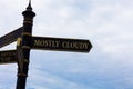 Text sign showing Mostly Cloudy. Conceptual photo Shadowy Vaporous Foggy Fluffy Nebulous Clouds Skyscape Road sign on