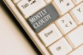 Text sign showing Mostly Cloudy. Conceptual photo Shadowy Vaporous Foggy Fluffy Nebulous Clouds Skyscape White pc keyboard with