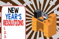 Text sign showing New Year S Resolutions. Conceptual photo Wishlist List of things to accomplish or improve Working desktop